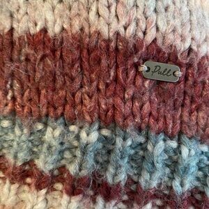 Selling this cozy sweater, not much use. It is really comfortable.